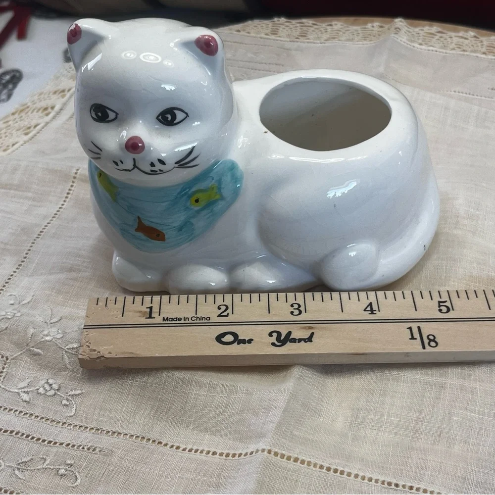 White Ceramic Cat-Shaped Planter with a Blue Scarf Adorned with Fish.